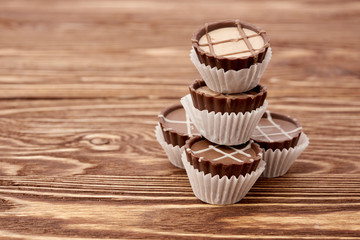 Dark chocolate on wooden background