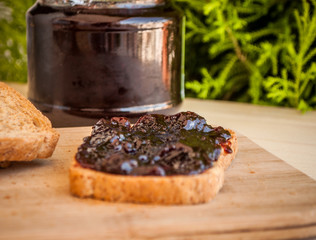 breakfast with sour cherry marmalade on toast with a glass of milk and frutis