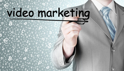 business man writing Video Marketing