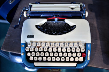 Old fashioned blue, white typewriter