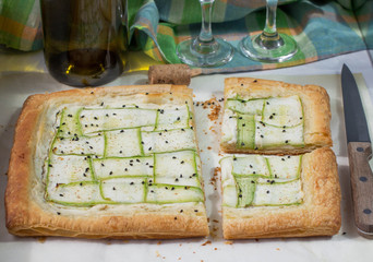 Tart  of puff pastry with  zucchini and goat cheese. Selective F