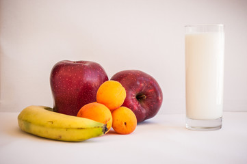a glass of milk and frutis