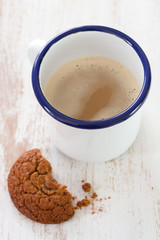 cup of coffee with milk and cookies