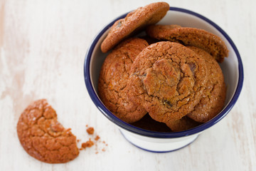 cookies in bowl on wooden background