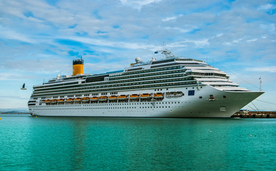 Cruise ship docked on a beautiful day.