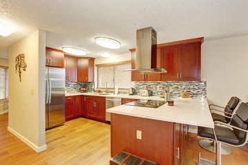 Well kept kitchen with hardwood floor.