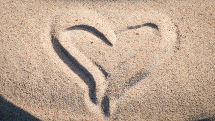 Heart shape on sand on a beach