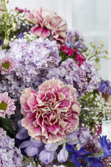 Obraz premium Bouquet of carnations, lilacs and chrysanthemums