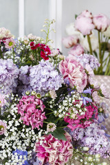 Obraz premium Bouquet of carnations, lilacs and chrysanthemums