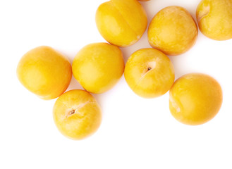 Pile of multiple yellow plums isolated