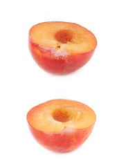 Cut open plum half isolated