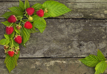 Raspberries on the Old Wooden Table