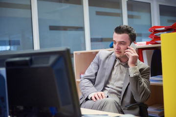 business man talking by phone in office