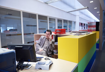 business man talking by phone in office