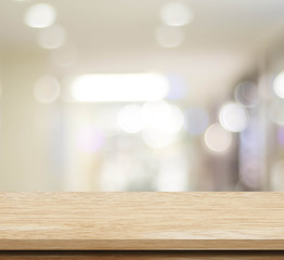 Empty table and blurred store with bokeh background, product display template.