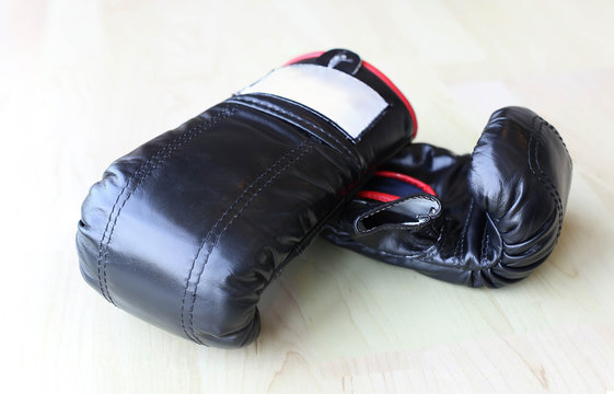 Pair of black leather boxing gloves