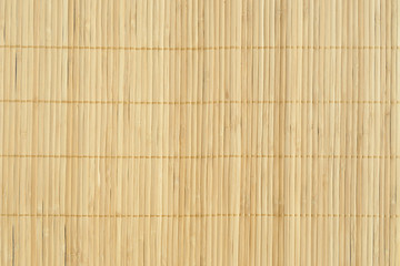 Bamboo brown straw mat as abstract texture background compositio