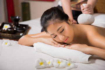 Obraz na płótnie Canvas Asian woman having massage and spa salon Beauty treatment concept. She is very happy