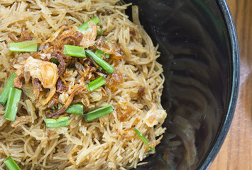 Thai- style noodles and fried garlic,leeks with Pork bone soup f