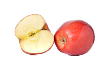 whole and half cut red apples with stem on white background