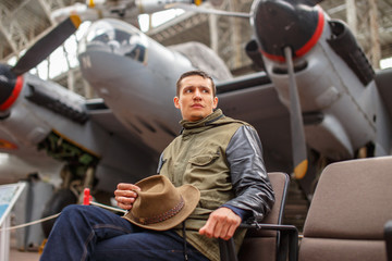 Casual man in airplane museum.