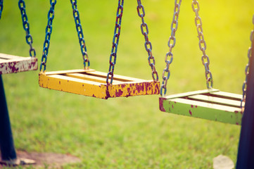 Empty chain swings in children playground