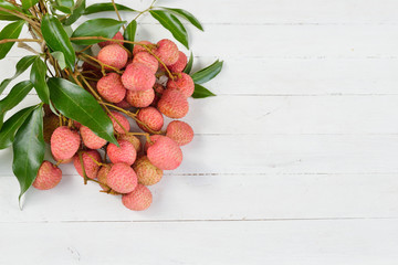 Fresh lychee on a wooden background