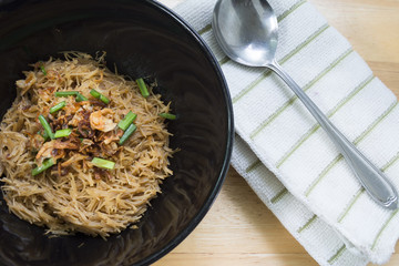 Thai- style noodles and fried garlic,leeks with Pork bone soup f