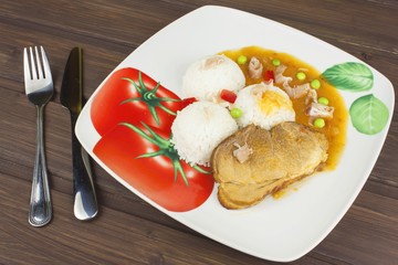 Slice roast pork with rice and sauce. Preparing homemade food. Delicious home-cooked meal for one person.
