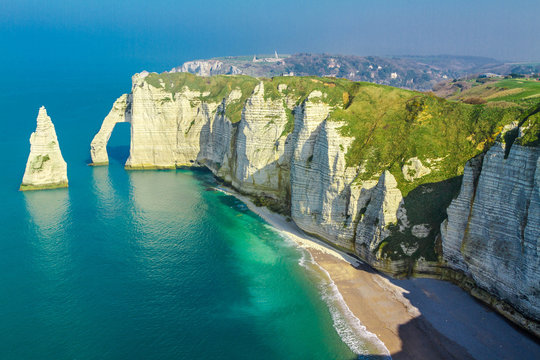 Aerial view of Porte d'Aval arch and L'Aiguille rock formations on the Etretat coastline, Seine-Maritime, Normandy, France