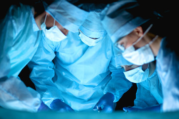 Team surgeon at work in operating room