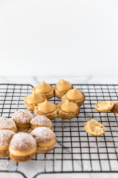 Paris Brest with caramel custard on a cooling tray