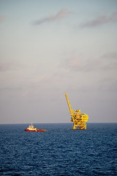 Supply ship leaving an oil and natural gas platform