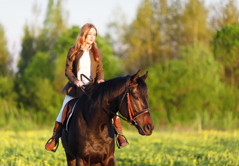 A girl riding a horse