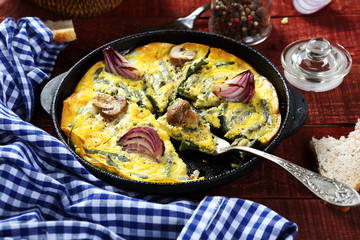 Scrambled eggs in a pan on the boards