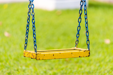 Empty chain swings in children playground