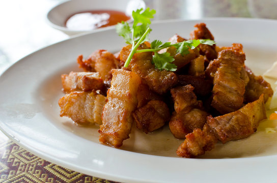 Fried pork belly with fish sauce, Thai recipe.
