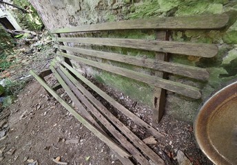 old wood bench in the old house destroyed