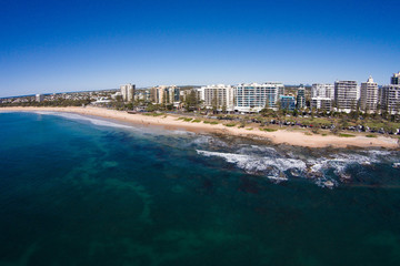 Fototapeta na wymiar Aerial view of beachfront hotels on sunrise