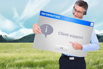 Happy businessman with headphone presenting a panel