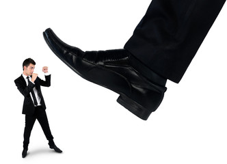 Feet man crushing little business man