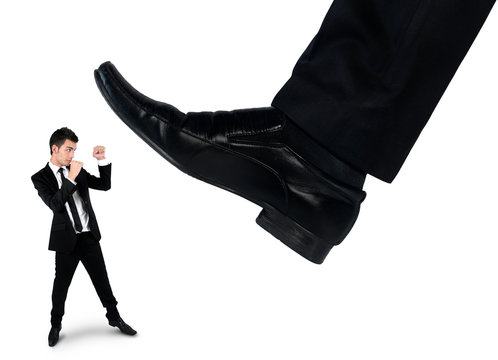 Feet man crushing little business man