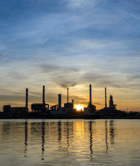 Oil refinery or petrochemical industry plant at sunrise