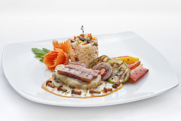 Fried meat stake with cheese, ham, white rice and vegetables