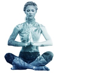 Calm blonde sitting in lotus pose with hands together