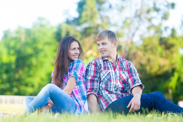 Fototapeta premium Young teen couple in the park