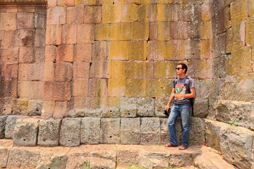 Man and The Wall of Prasat Hin Phanom Rung castle