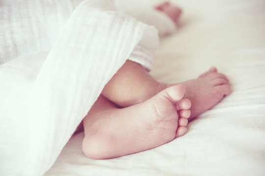 Soft focus and blurry of Baby Feet, vintage style color effect