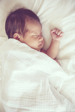 Soft focus and blurry of Carefree sleep little baby, vintage sty