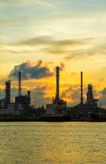 Oil refinery along the river at Dusk (Bangkok, Thailand)